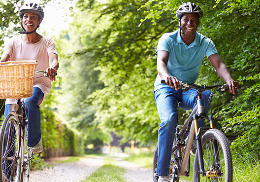 a man and lady riding bicycles