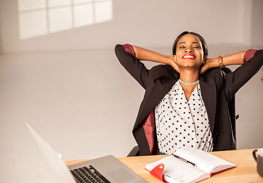 woman stretching in her office chair