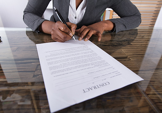 lady signing a document