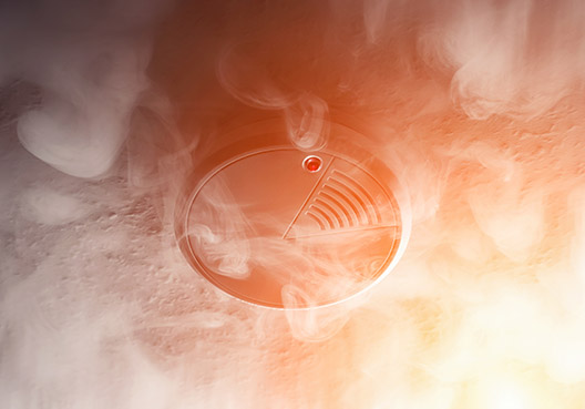 smoke detector covered in smoke