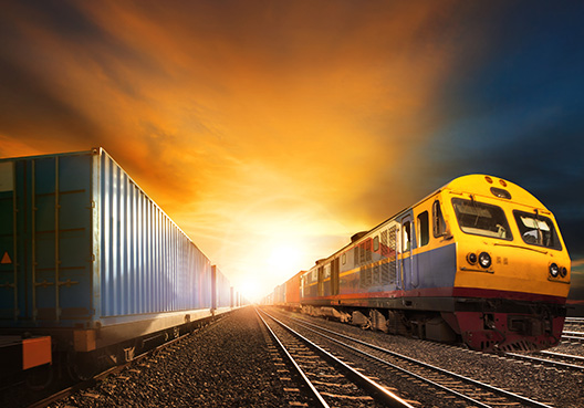 yellow training driving on train tracks