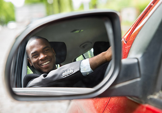 reflection of a man through the side mirrors